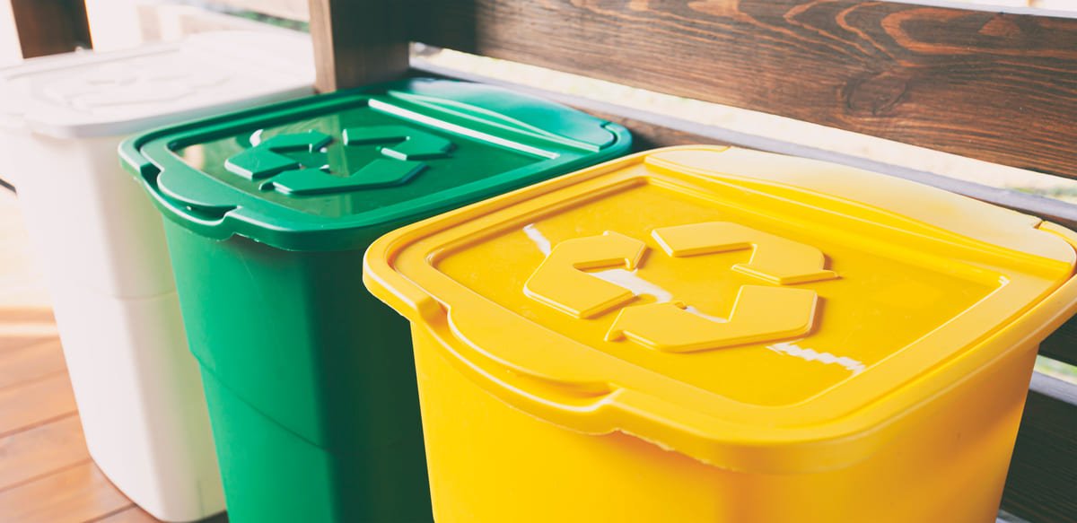 yellow green white containers with lids for separate waste collection