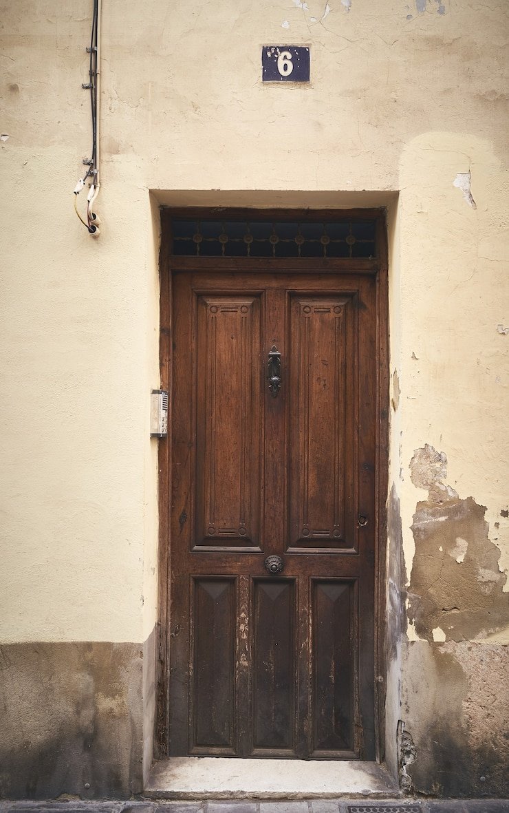 The process of restoring an ancient wooden door